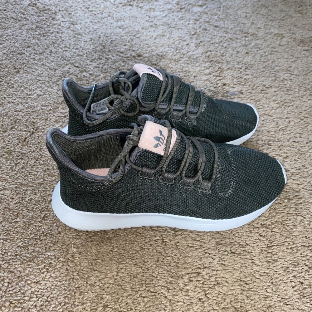 Women’s green adidas sneakers